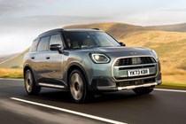MINI Countryman (2024) review: front three quarter driving, silver paint, British country road