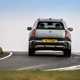 MINI Countryman (2024) review: rear three quarter cornering, silver paint, British country road