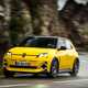 Renault 5 E-Tech (2024) review: front three quarter cornering, low angle, yellow paint