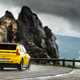 Renault 5 E-Tech (2024) review: rear three quarter cornering, wide angle, yellow paint