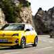 Renault 5 E-Tech (2024) review: front three quarter cornering, through a valley, yellow paint