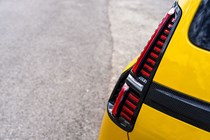 Renault 5 E-Tech (2024) review: rear light detail shot, yellow paint