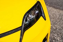 Renault 5 E-Tech (2024) review: headlight detail shot, yellow paint