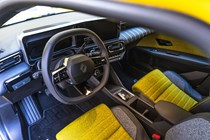 Renault 5 E-Tech (2024) review: dashboard and interior, yellow and black fabric upholstery