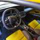 Renault 5 E-Tech (2024) review: dashboard and interior, yellow and black fabric upholstery