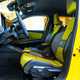 Renault 5 E-Tech (2024) review: front seats and steering wheel, yellow and black fabric upholstery