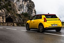 Renault 5 E-Tech (2024) review: rear three quarter static, low angle, yellow paint