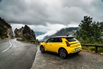 Renault 5 E-Tech (2024) review: rear three quarter static, wide angle, yellow paint