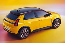 Renault 5 E-Tech Electric (2025): rear three quarter static, high angle, yellow paint, studio shoot