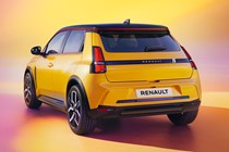 Renault 5 E-Tech Electric (2025): rear three quarter static, low angle, yellow paint, studio shoot