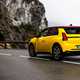 Renault 5 E-Tech (2024) review: rear three quarter static, low angle, yellow paint