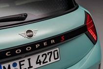 MINI Cooper (2024): tailgate and badging detail, teal paint, studio shoot