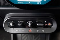 MINI Cooper (2024): climate controls and drive mode switches, black trim