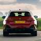 BMW i5 Touring: M60 model, rear cornering, red paint