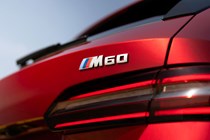 BMW i5 Touring: M60 model, tailgate badge, red paint