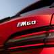 BMW i5 Touring: M60 model, tailgate badge, red paint