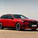 BMW i5 Touring: M60 model, front three quarter static, red paint
