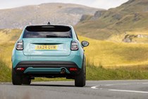 Fiat 600 Hybrid review - dead-on rear, blue, driving round corner