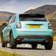 Fiat 600 Hybrid review - rear, blue, driving round corner