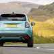 Fiat 600 Hybrid review - dead-on rear, blue, driving round corner