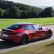 Porsche Panamera GTS: rear three quarter driving, red paint, spoiler extended