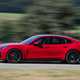 Porsche Panamera GTS: side view driving, red paint