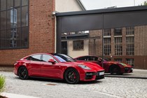 Porsche Panamera GTS: front three quarter static, black upholstery, reflection