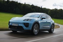 Porsche Macan Electric (2024) review: front three quarter driving, blue paint