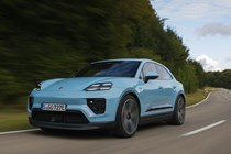 Porsche Macan Electric (2024) review: front three quarter driving, blue paint, low angle