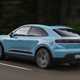 Porsche Macan Electric (2024) review: rear three quarter driving, blue paint, low angle