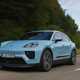 Porsche Macan Electric (2024) review: front three quarter driving, blue paint, low angle