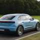 Porsche Macan Electric (2024) review: rear three quarter driving, blue paint