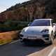 Porsche Macan (2024) review: front three quarter cornering, mountain road, silver paint