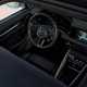 Porsche Macan (2024) review: dashboard and infotainment system, black upholstery, through the sunroof