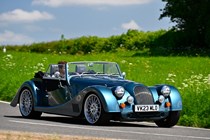 Morgan Plus Six review - front, blue, driving round corner in British sunshine, exclusive Bauer image