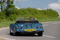 Morgan Plus Six review - rear, blue, driving round corner, exclusive Bauer image