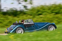 Morgan Plus Six review - rear side, blue, driving in countryside, exclusive Bauer image