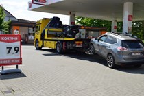 Recovery truck pulling Nissan X-Trail in Belgium.