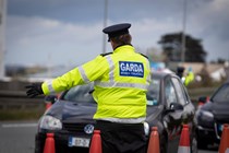 Garda officer at roadside checkpoint - Driving in Ireland