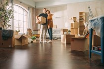 Happy couple moving into new home - How to renew driving license