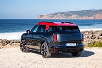 MINI Countryman JCW (2024) review: rear three quarter static, black and red paint