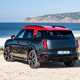 MINI Countryman JCW (2024) review: rear three quarter static, black and red paint