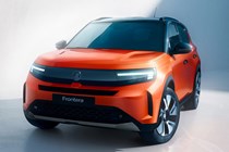 Vauxhall Frontera (2024): front three quarter static, low angle, studio shoot, orange paint