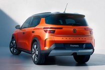 Vauxhall Frontera (2024): rear three quarter static, studio shoot, orange paint