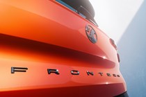 Vauxhall Frontera (2024): tailgate badge detail shot, orange paint