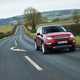 Land Rover Discovery Sport, red, front right three-quarters, driving