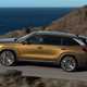 Skoda Kodiaq (2024) review: side view driving, gold paint, country road