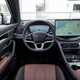 BYD Seal U DM-i (2024) review: dashboard and infotainment system, from driver's seat, black and tan upholstery