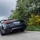 Maserati GranCabrio Trofeo review: rear three quarter driving, low angle, black paint