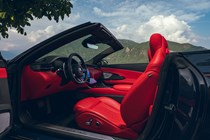 Maserati GranCabrio Trofeo review: front seats and dashboard, red leather upholstery